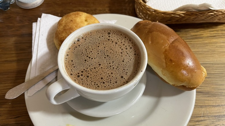 Cup of hot chocolate with cheese bread