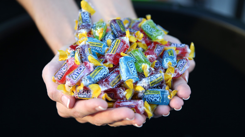 handfuls of Jolly Ranchers candy