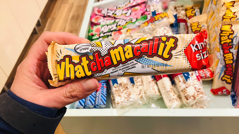 person holding Whatchamacallit bar
