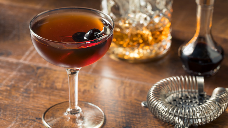 Manhattan cocktail coupe with cherry