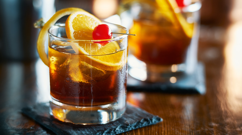 Old fashioned cocktail with cherry 