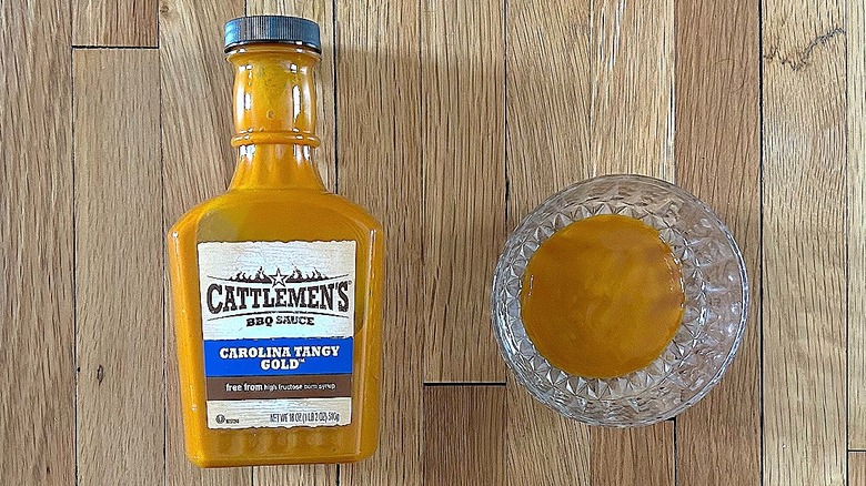 Bottle and glass bowl of Cattlemen's Carolina Tangy Gold BBQ