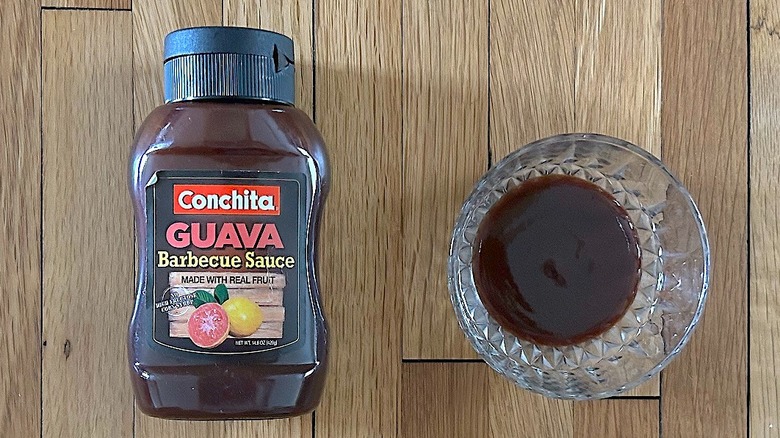 Bottle and glass bowl of Conchita Guava BBQ Sauce