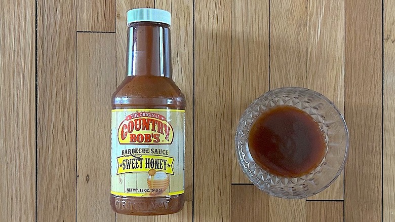 Bottle and glass bowl of Country Bob's Sweet Honey Barbecue Sauce