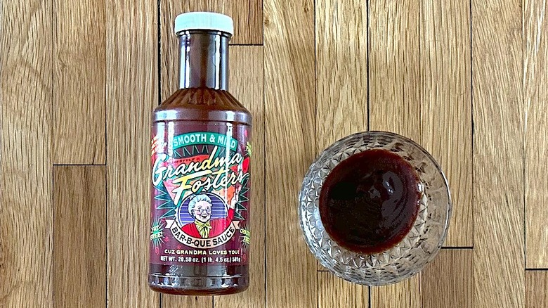 Bottle and glass bowl of Grandma Foster's Smooth and Mild Bar-B-Que Sauce