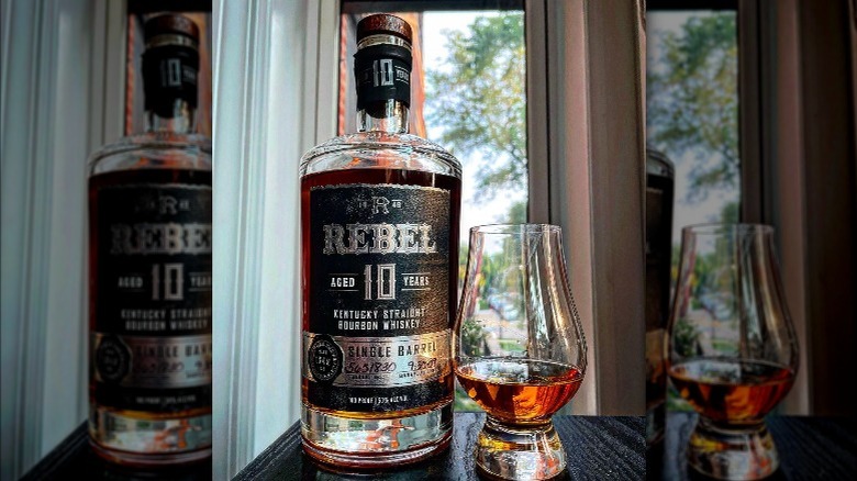 Rebel Bourbon bottle and glass