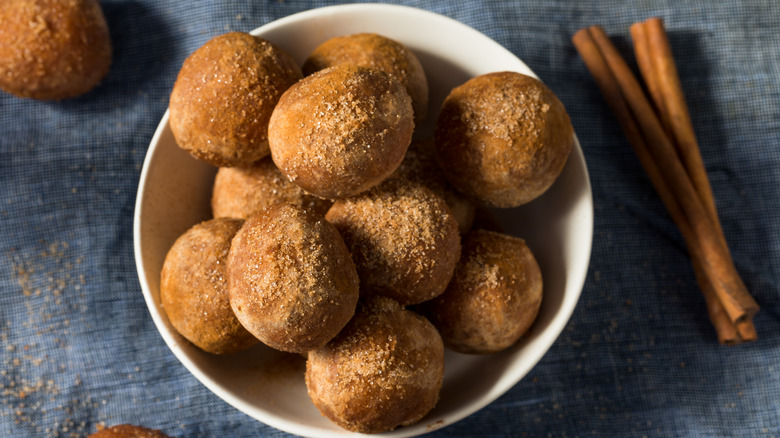 donut holes with cinnamon sticks