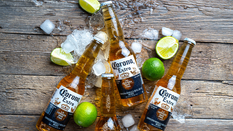 Coronas, limes and ice on a table