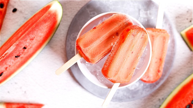 watermelon popsicles over ice