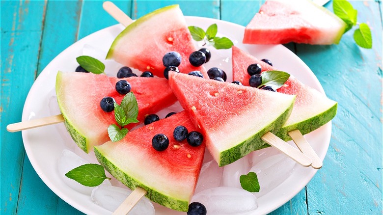 slices of watermelon on sticks 