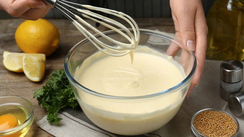 Woman making mayonnaise