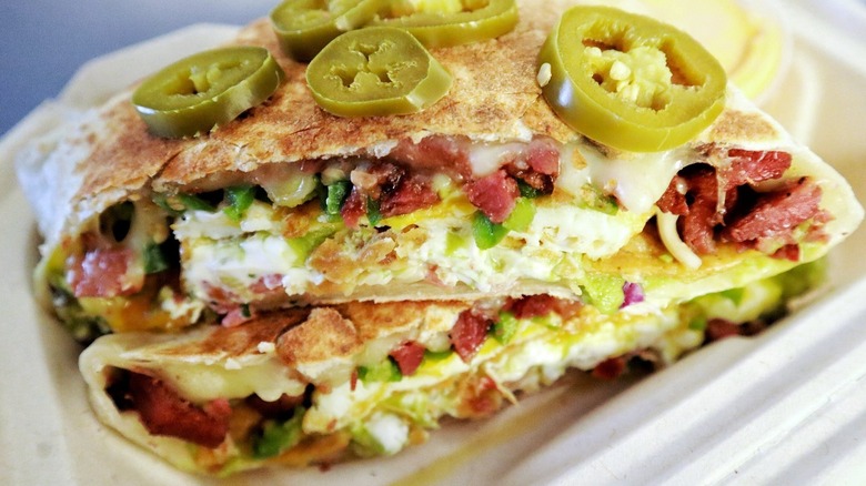 Filled flour wraps in a carton close up