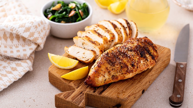 chicken breast on cutting board