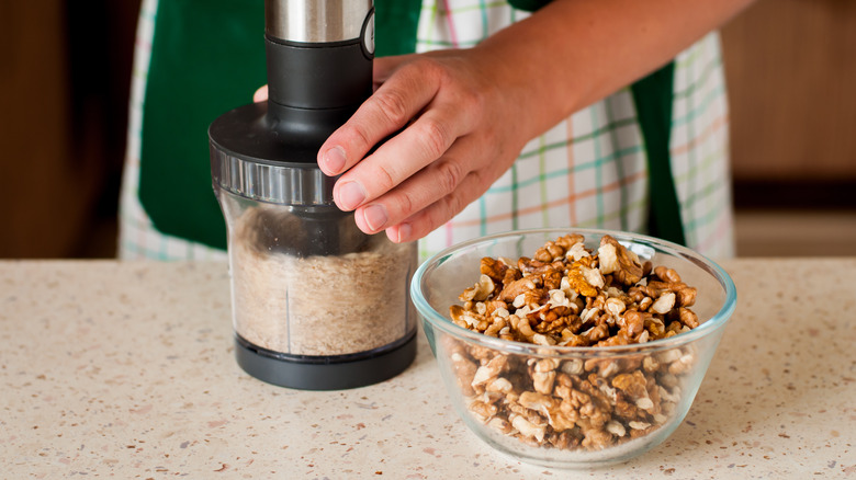 A food processor full of walnuts