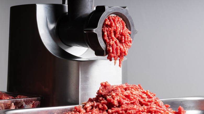 meat grinder in use