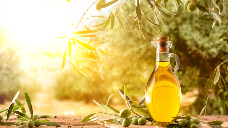 Decanter of olive oil in sun