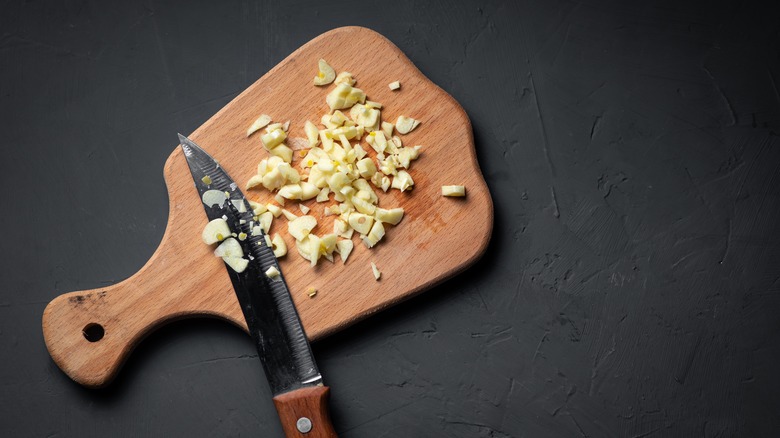 Chopped garlic on a wooden board