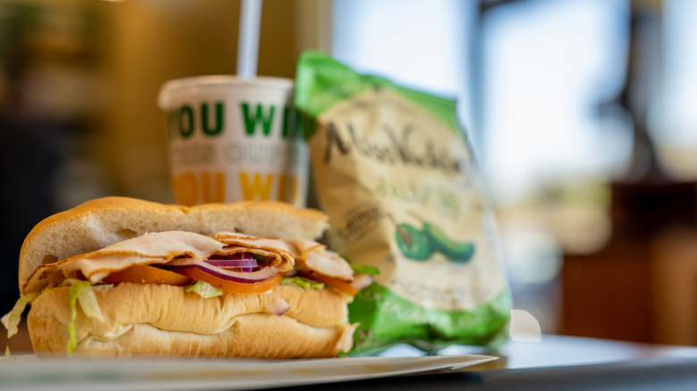 Subway sandwich with chips and drink