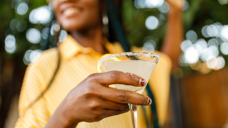 Person holding cocktail