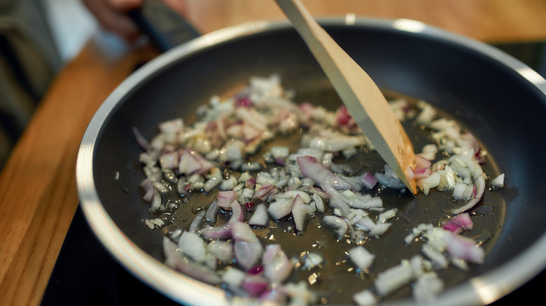 Onions and garlic cooking in pan 