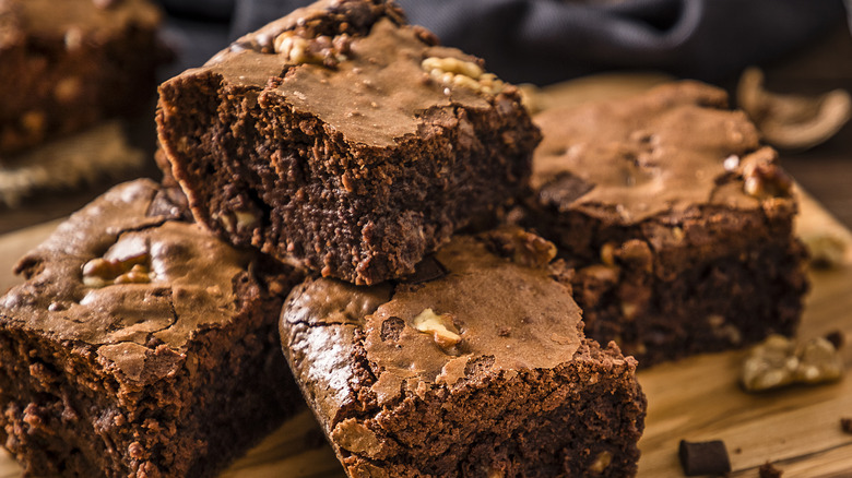 Pile of brownies on a cutting board