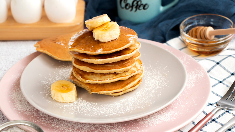 Stack of pancakes with bananas