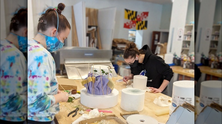 Charm City Cakes employees decorating