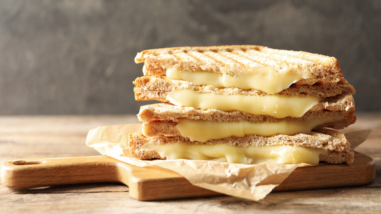 Stack of gooey grilled cheese sandwiches