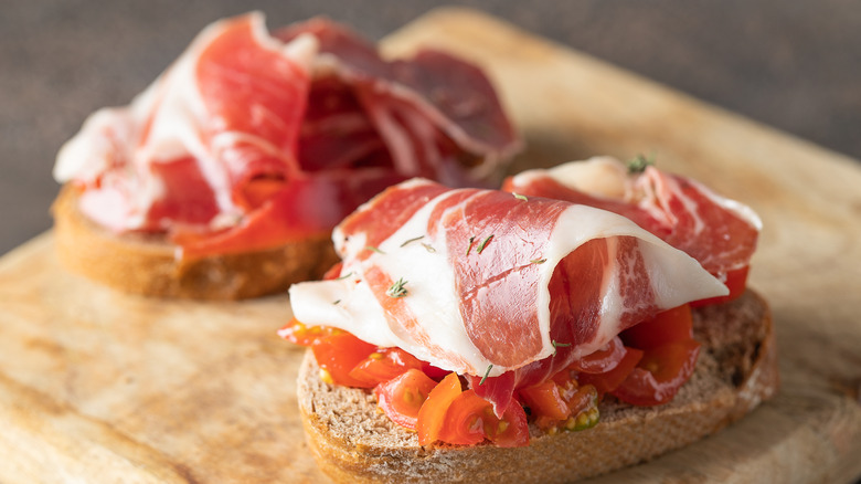 Bruschetta bread topped with prosciutto