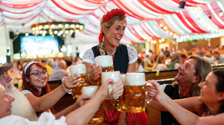 Friends drinking beer in Oktoberfest tent