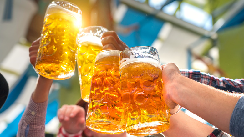 toasting beer mugs at Oktoberfest