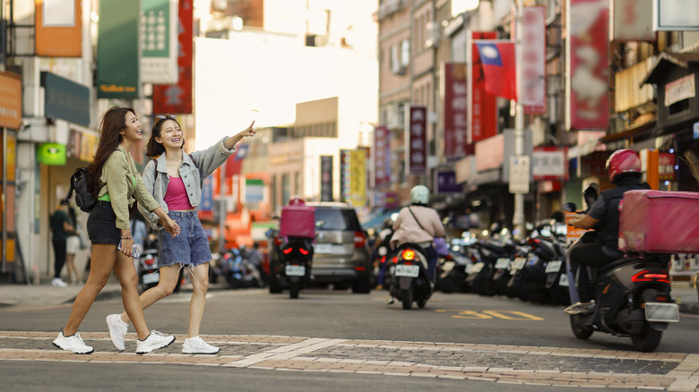 two women walking down street in Taiwan