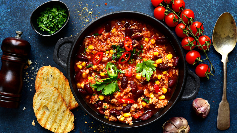 chili surrounded by fresh ingredients