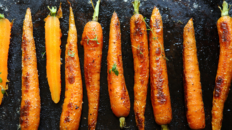 Roasted carrots on dark background