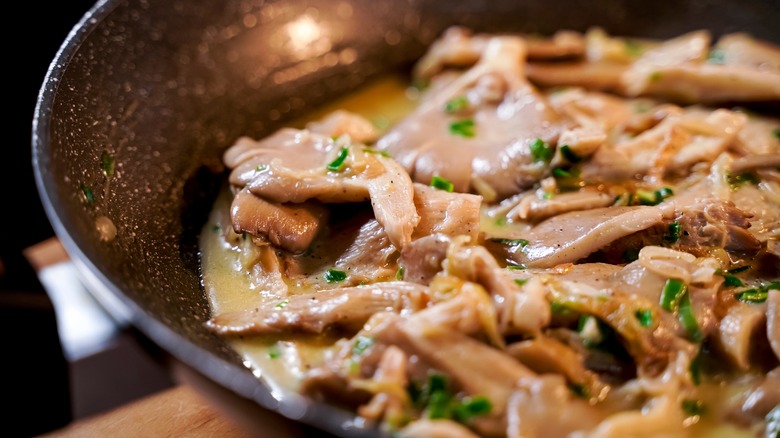 Mushrooms cooking in a pan