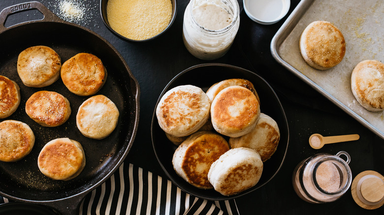 English muffins on pans and trays