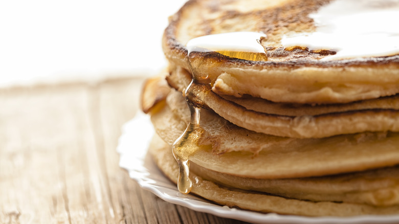 pancakes on plate with syrup