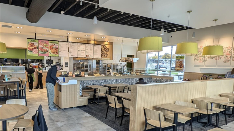 Customers and workers inside a Panera Bread