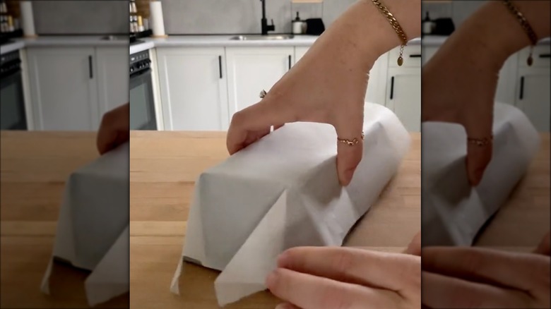 Folding parchment paper around a loaf pan