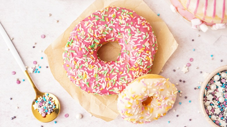 Donuts on parchment with sprinkles