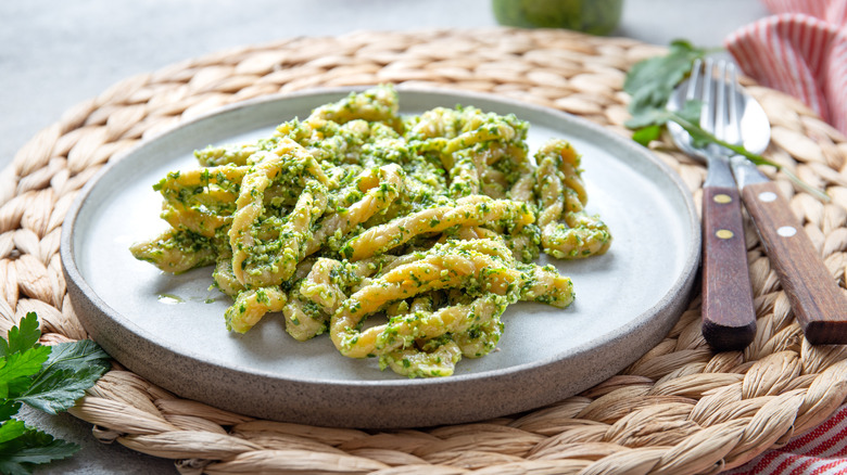 lorighittas in pesto, plated with silverware