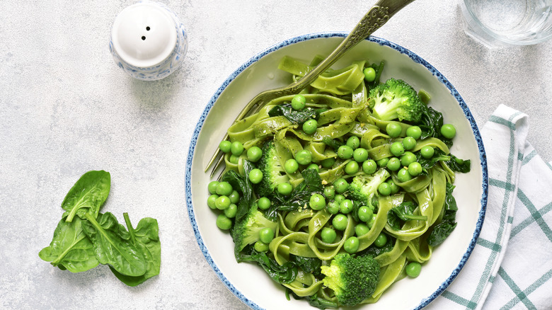 Spring pasta primavera in blue and white bowl