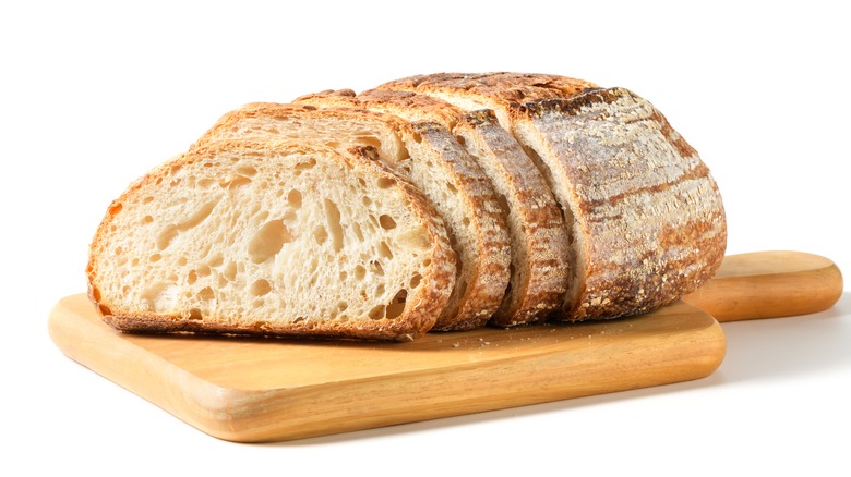 bread loaf sliced on a cutting board.