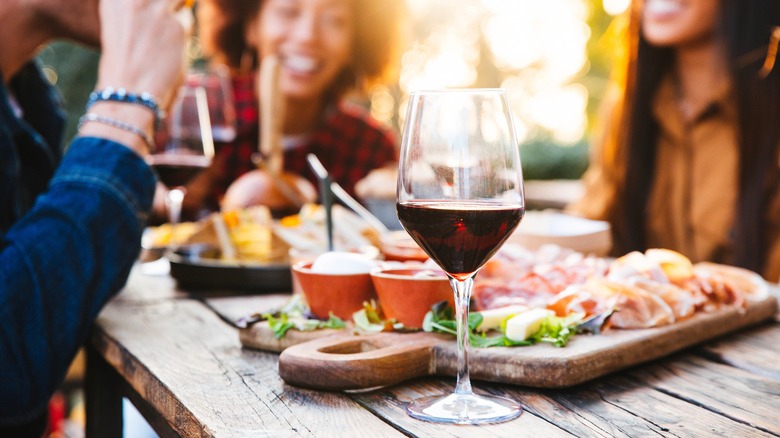 wine glass on table with food