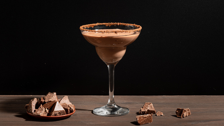 chocolate Margarita cocktail with chocolate chunks on a stylish dark background