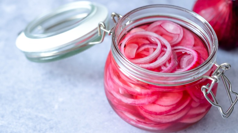 Pickled red onions in glass jar