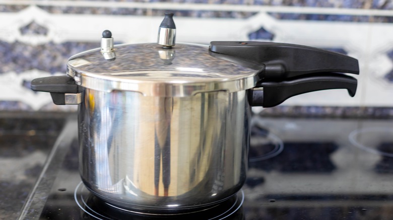 Traditional pressure cooker on a burner