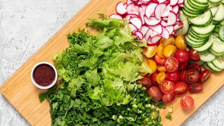 Cutting board of chopped veggies