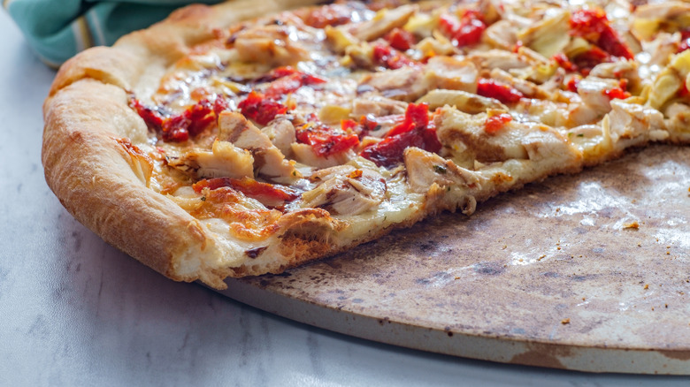 pizza baked on a pizza stone