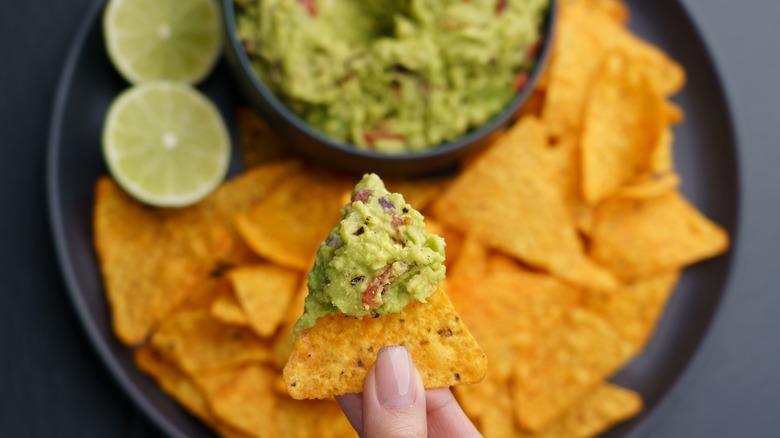 Tortilla chip with guacamole